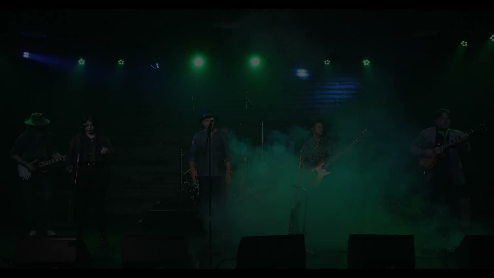 Terry Lee and band performing in Poisoning the Well