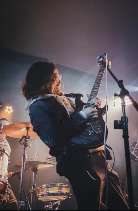 Eric Vattima performing live on guitar